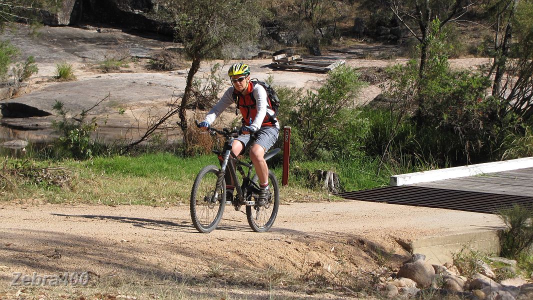 02-Heidi starts her MTB ride in Boonoo Boonoo NP.JPG